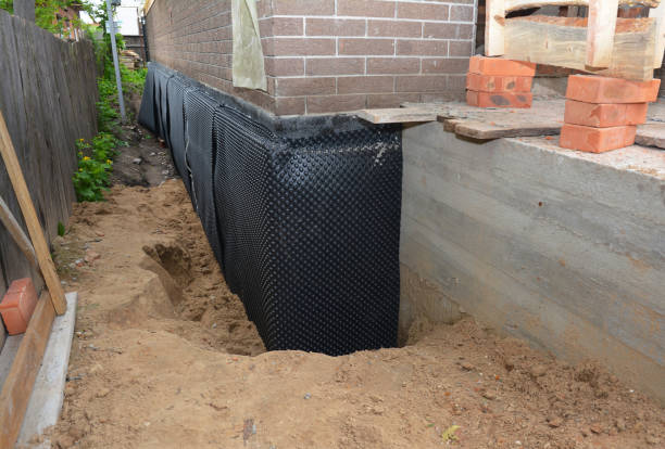 Happy homeowners after waterproofing job in Risingsun